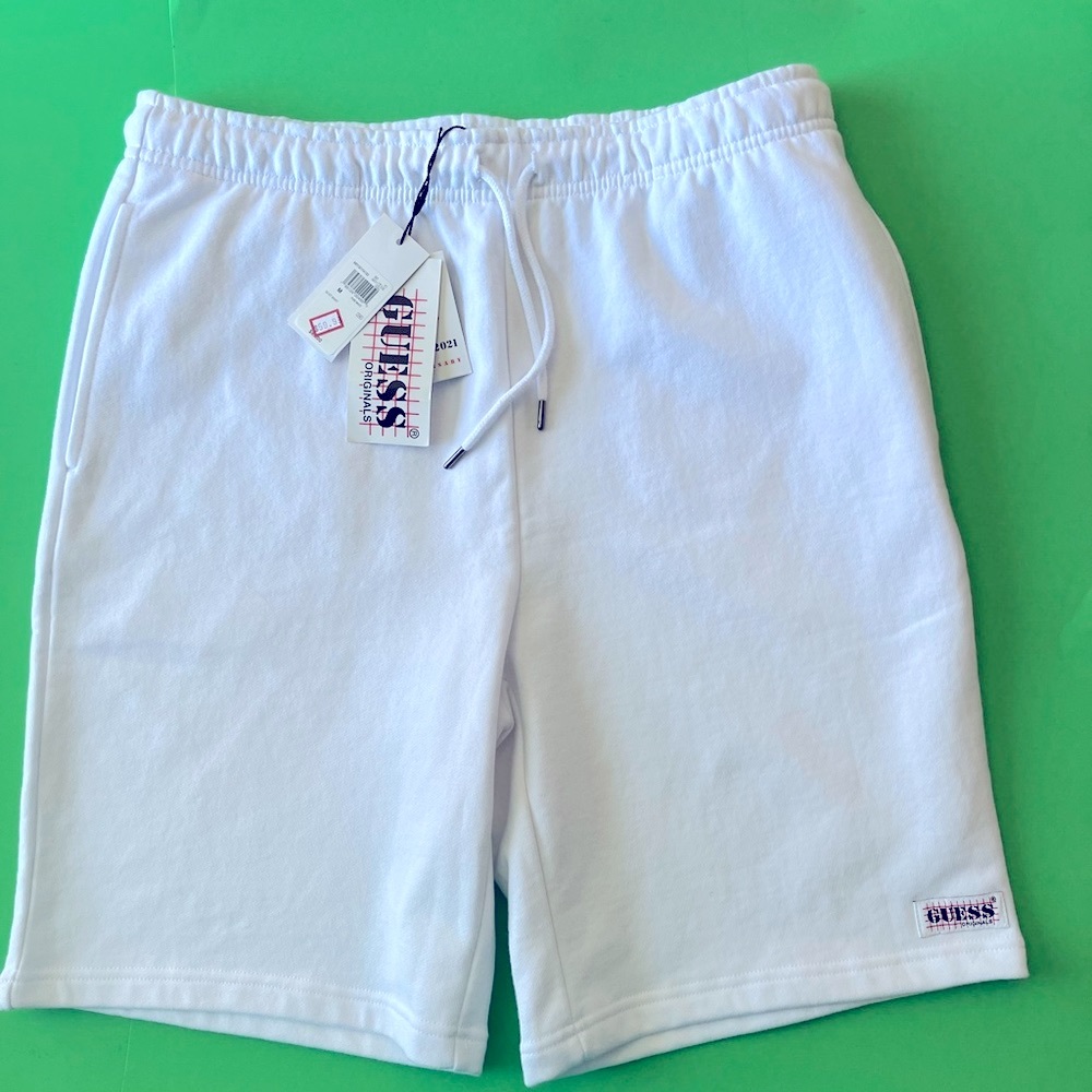 GUESS. Cotton shorts. Waist tie. 2 nice side pockets & 1 zippered back pocket.